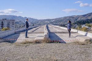 Photo of Oksana and Arthur on a bridge leading nowhere