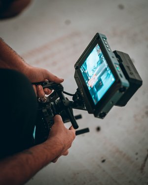 Decorative element: Videographer at work with camera