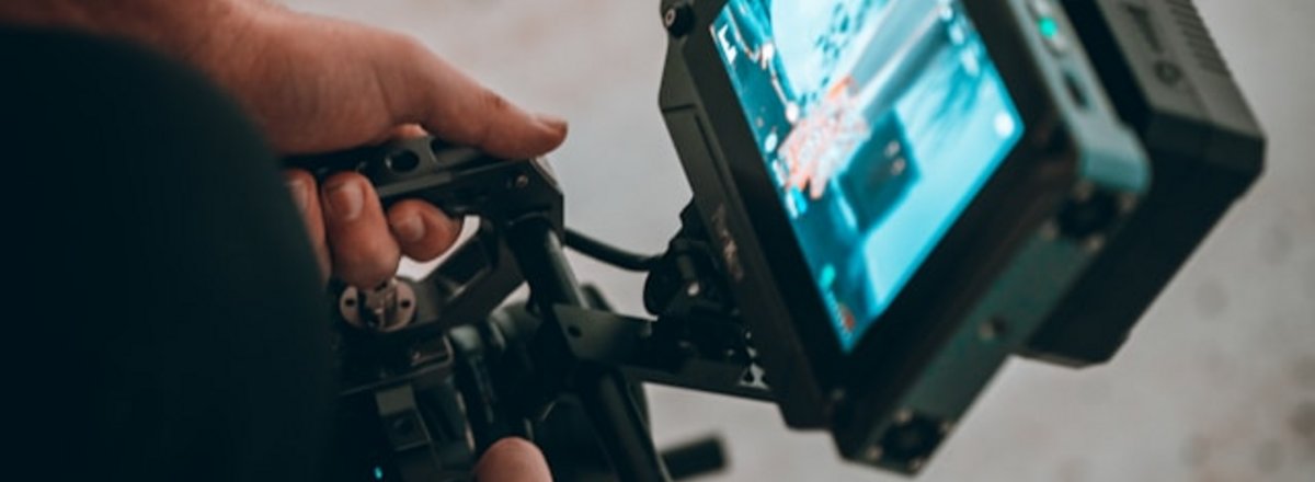Decorative element: Videographer at work with camera