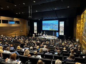 Decorative image: Main event hall at conference