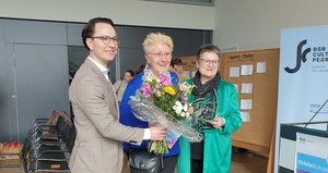 Representatives from CBSS and Kiel with the BSR Cultural Pearls trophy and a flower bouquet