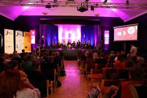 A podium dicussion during the forum